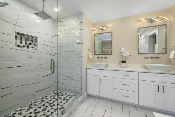 White bathroom remodel with custom tile shower and double vanity by SmartSpaces ADUs in Grayson, GA